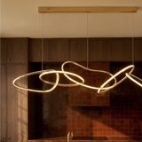 The loops lit in a dark wood kitchen with tiled walls and warm afternoon light
