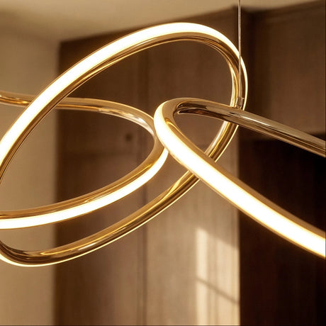 The profile of one loop, brushed metal outside and a lit strip inside
