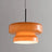 Amber tinted glass shade on a plain background