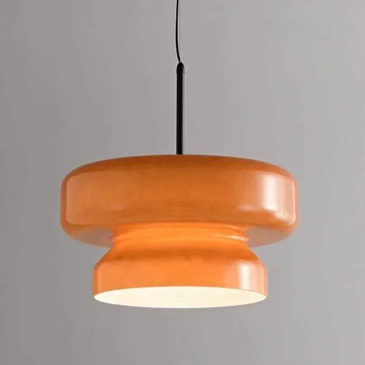 Amber tinted glass shade on a plain background