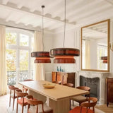 Tinted glass shade hung in a bedroom