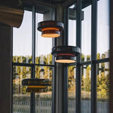 Tinted glass shade in a room with a dark green wall