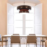 Tinted glass shade hung in a hallway