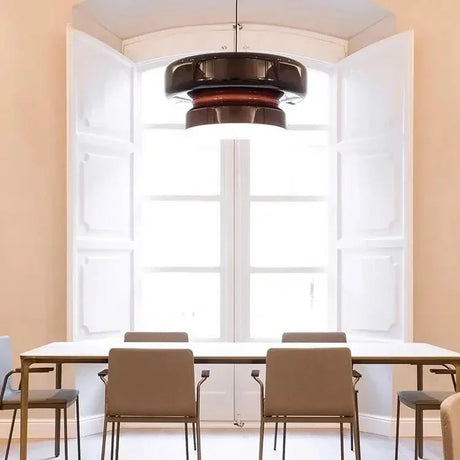 Tinted glass shade hung in a hallway