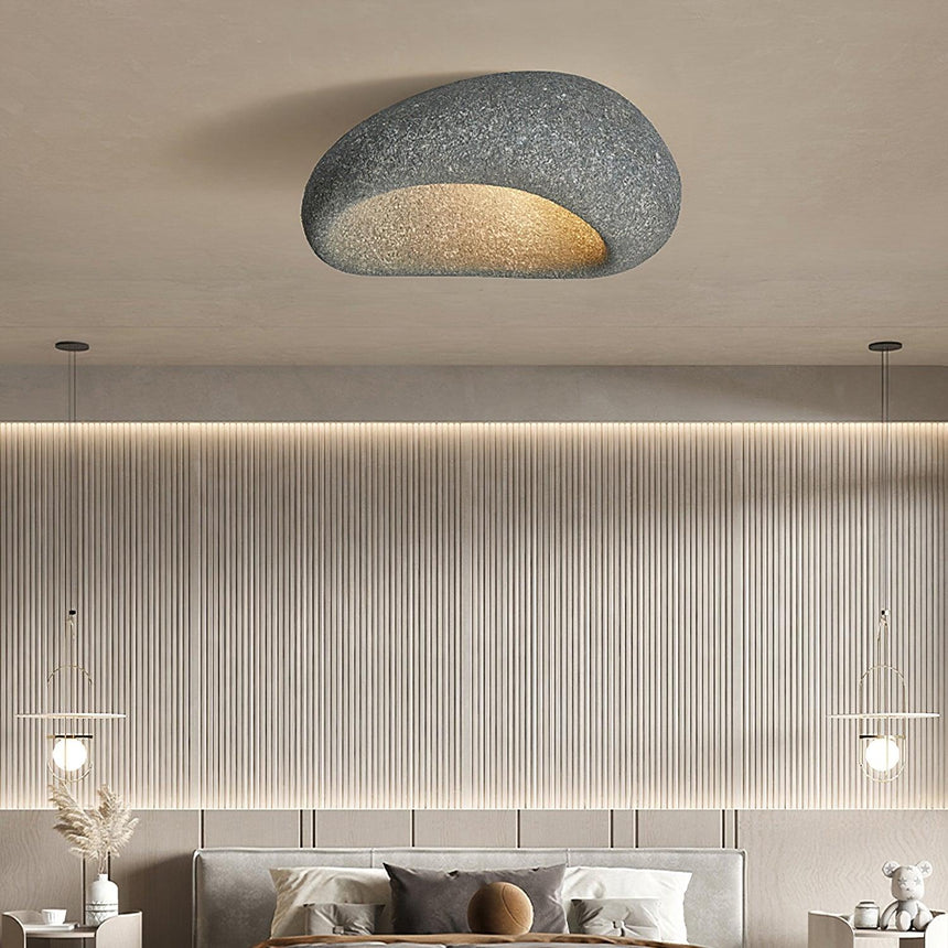 Textured dome ceiling light in a living room with a fluted wall panel
