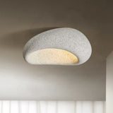 Light gray stone spot dome ceiling light against a plain background