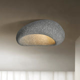 Dark gray stone spot dome ceiling light against a plain background