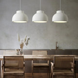 Pair of textured domes in a room with a wooden table