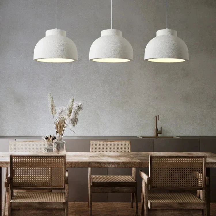 Pair of textured domes in a room with a wooden table