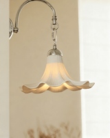 Close view of the chrome chain links and the ruffled rim lit