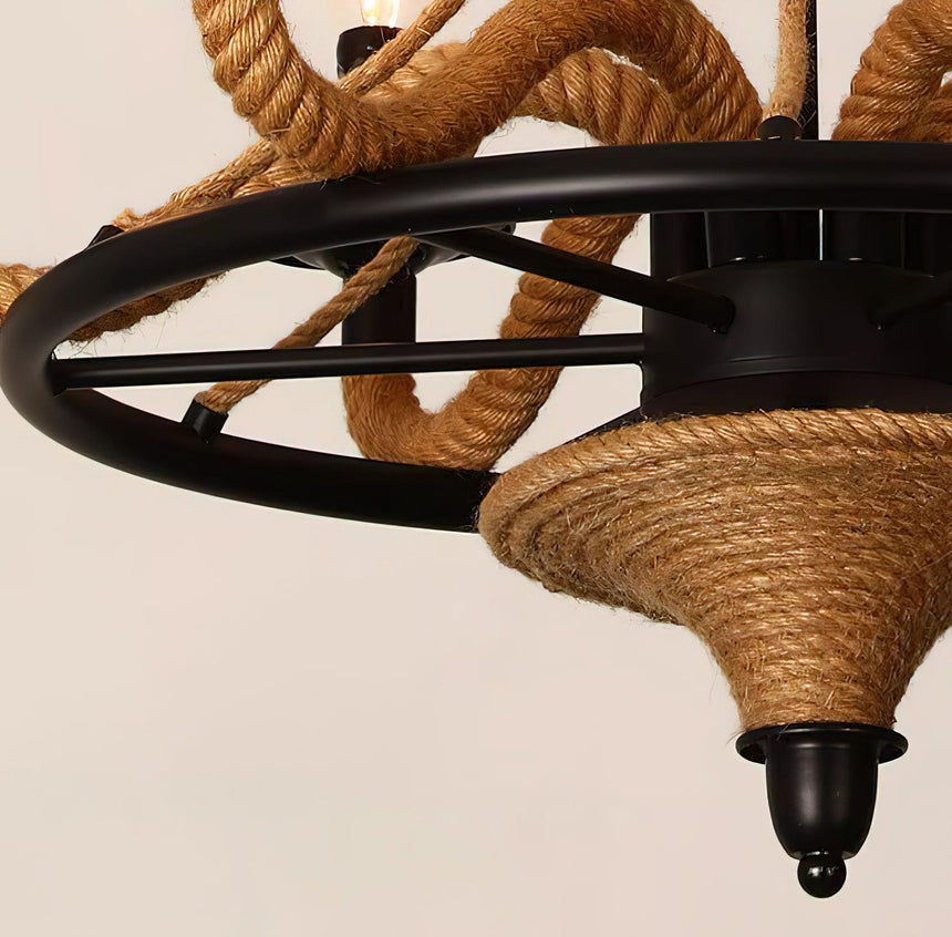 The spoked iron wheel and the rope wrapped cone beneath it