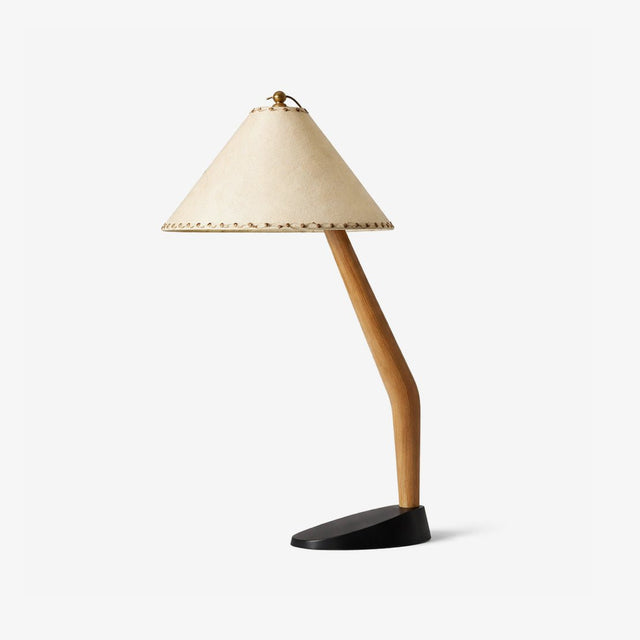 Rustic table lamp with an angled wood stem and a beige shade, plain background
