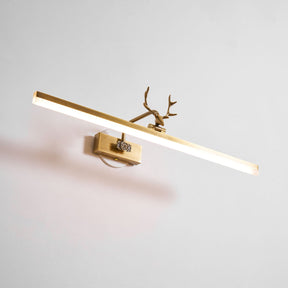 The bar lit on a pale wall, the antler head dark against the bright tube