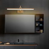Gold antler bar lit above a dark cabinet and a wide screen in a dark room