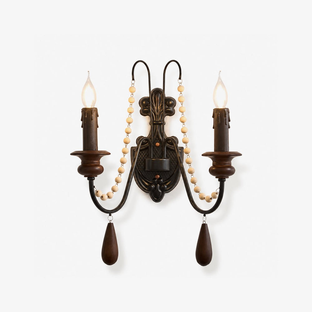 Rustic wall lamp, an iron scroll hung with wood beads carrying two candle arms