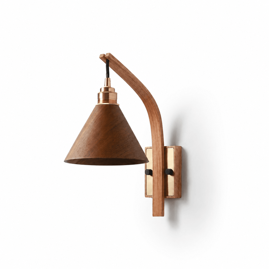 Walnut cone shade on a curved light wood arm, seen against a pale wall