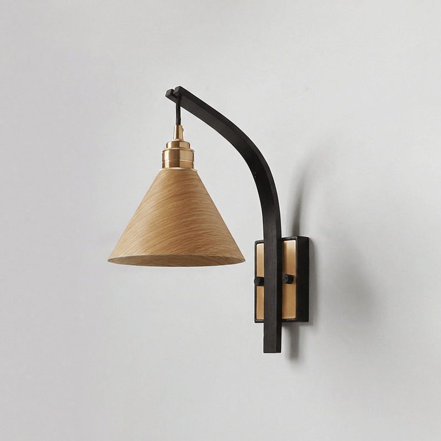 Light wood cone shade on a curved black arm with a brass canopy