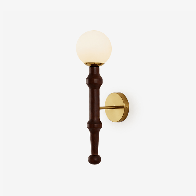 Rustic wall sconce, a turned walnut column on a brass plate with a glass globe