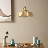 Beige scalloped shade above a dining corner with cups and a soft artwork