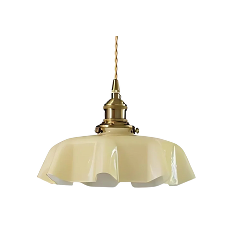 Beige scalloped glass shade with a brass top on a plain white background