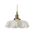 White scalloped glass shade with a brass top on a plain white background