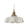 White scalloped glass shade with a brass top on a plain white background