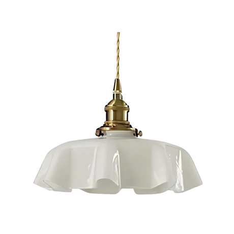 White scalloped glass shade with a brass top on a plain white background