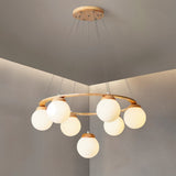 The wood ring seen from a low angle with the globes lit and a pale ceiling above