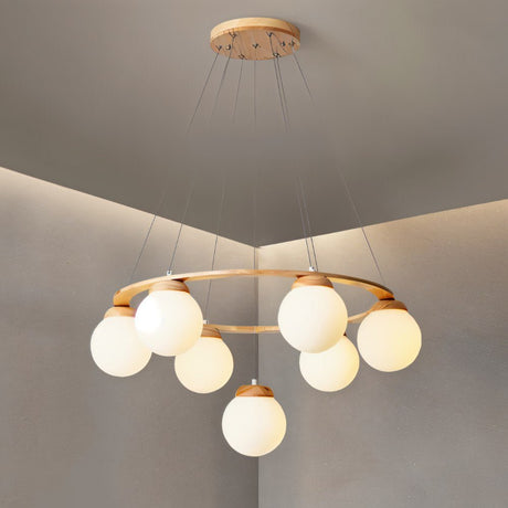 The wood ring seen from a low angle with the globes lit and a pale ceiling above