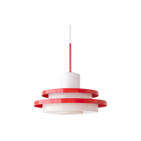 Red disc pendant photographed straight on against white