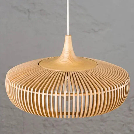 Slatted wood shade seen from below showing the ring of slats