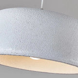 Wide textured dome seen close, the matte surface catching a low light