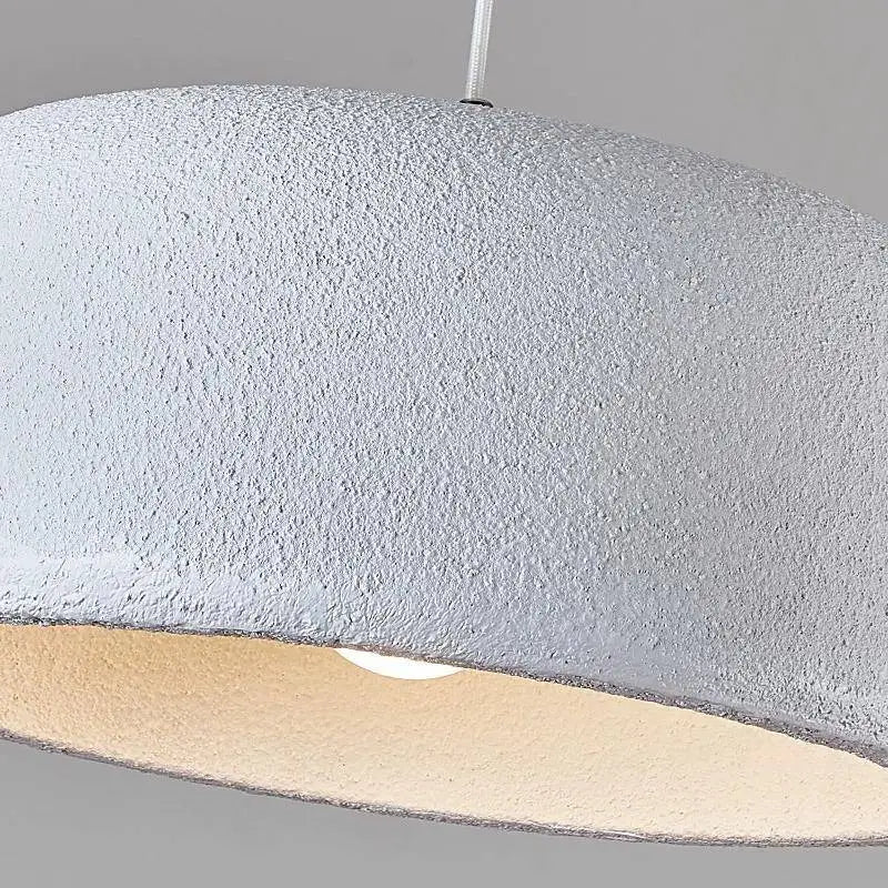 Wide textured dome seen close, the matte surface catching a low light