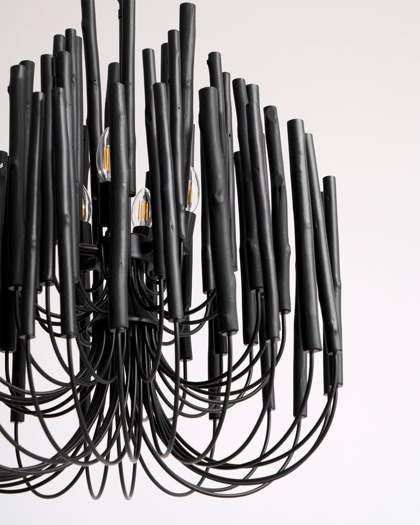 Black wood rods and the curved arms that hold them, seen close