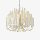 Sculptural chandelier with layered white wood rods on curved arms