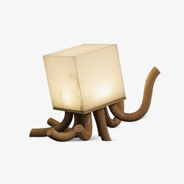 Sculptural table lamp with carved wood roots under an alabaster cube