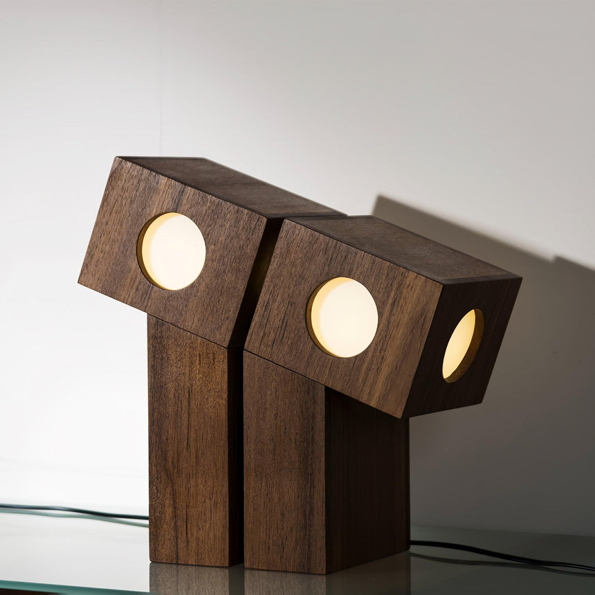 Both sizes of the teak lamp side by side with all diffusers lit