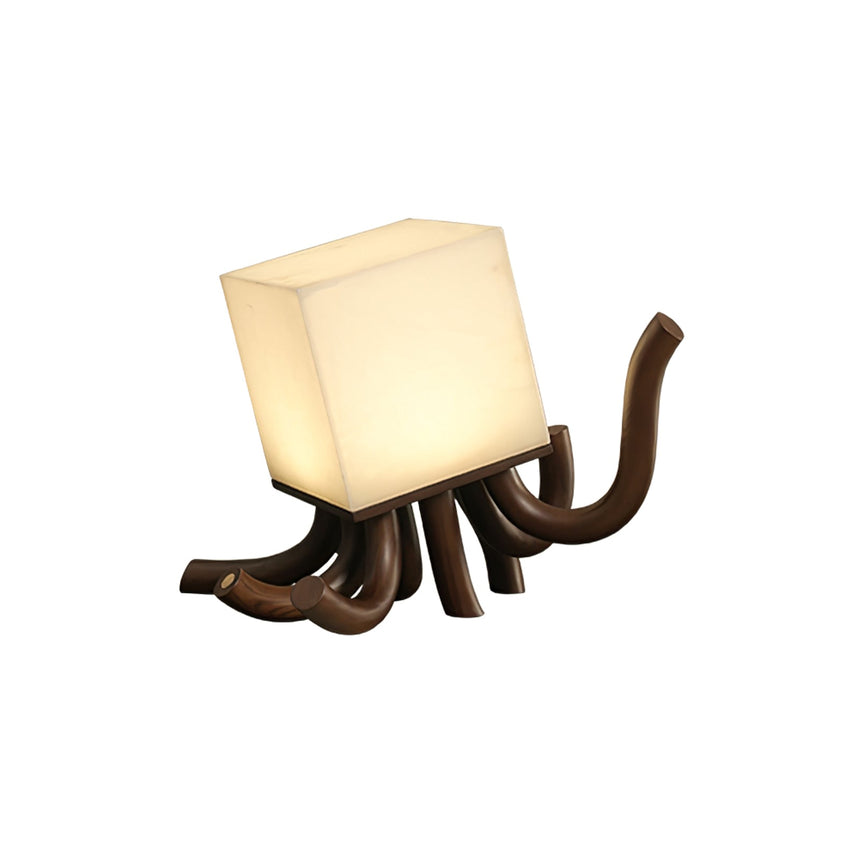 Sculptural table lamp with walnut carved roots seen from the front