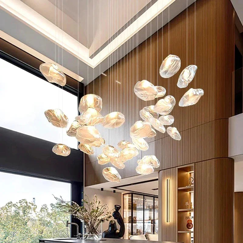 The cluster lit against a slatted wood wall above a lounge seating area
