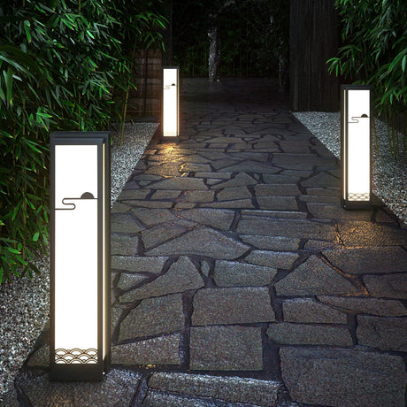 Two lit either side of a flagstone path with bamboo planting behind