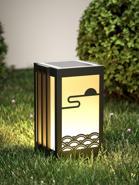 The short body lit on a lawn with the solar cap visible on top