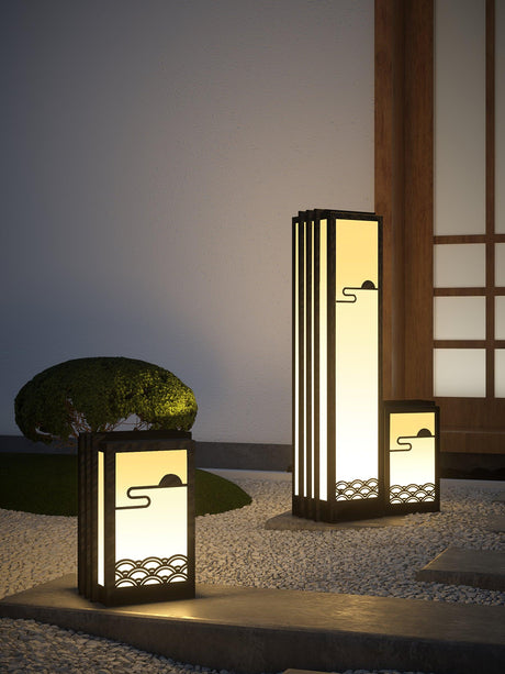 Two lit beside a pale stone and a timber screen in a quiet courtyard
