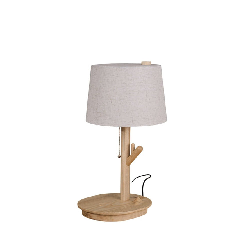 Branch stem side table lamp in light wood against a plain white ground
