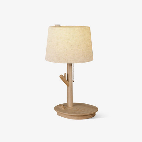 Side table lamp with a branch stem on a shallow wood tray, shade unlit