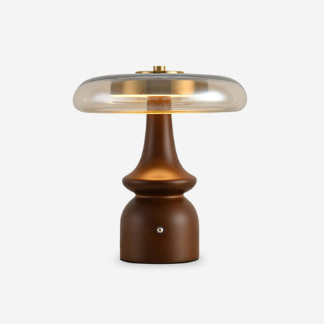 Side table lamp seen from the front against a plain pale ground
