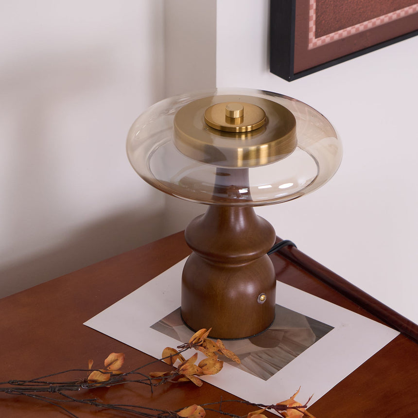 Side table lamp seen from above on a desk, the glass ring in view