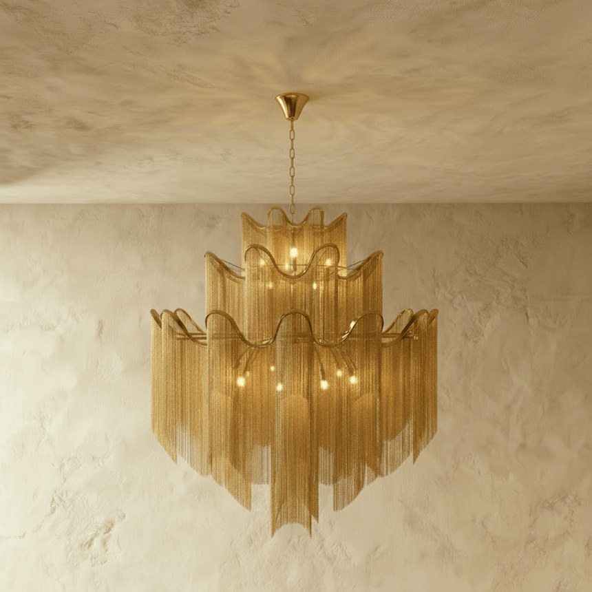 A four tier gold version, each band waved and fringed with fine chain