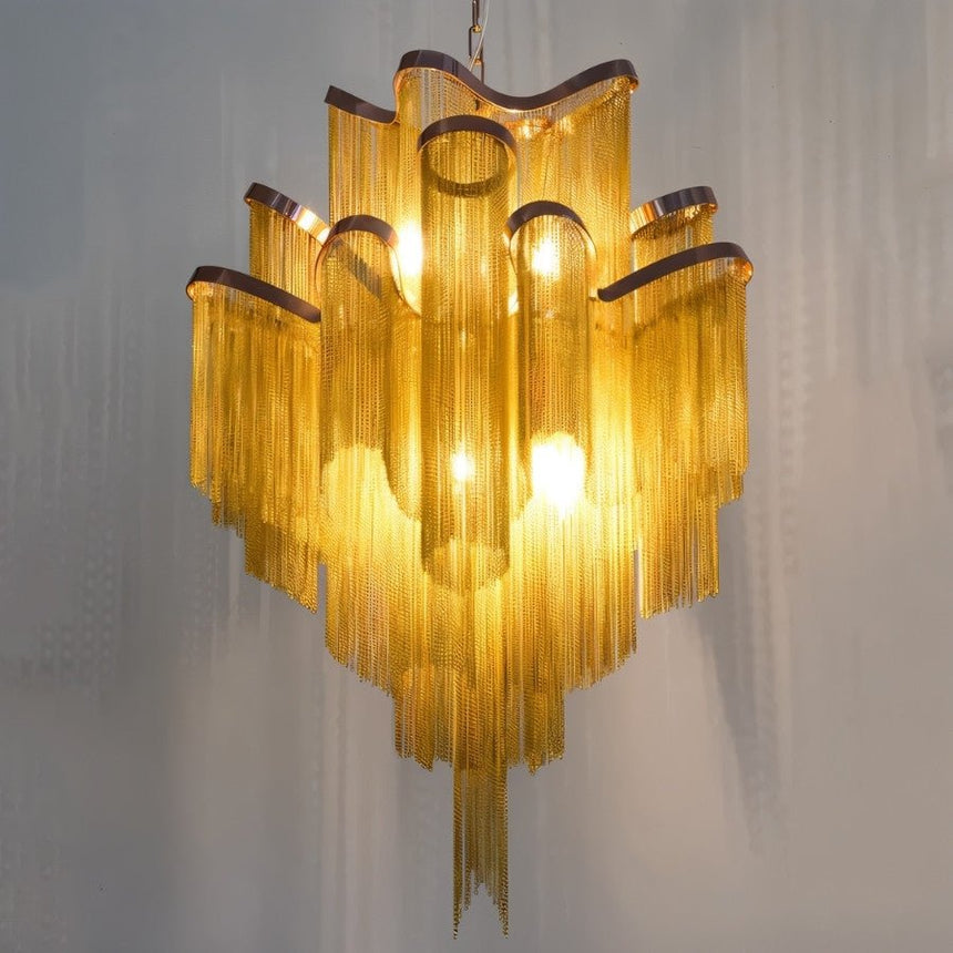 The gold bands lit from within, the chain curtains catching the light below