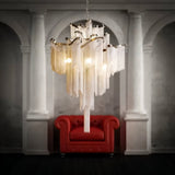 The silver version hanging between stone columns above a deep red button sofa