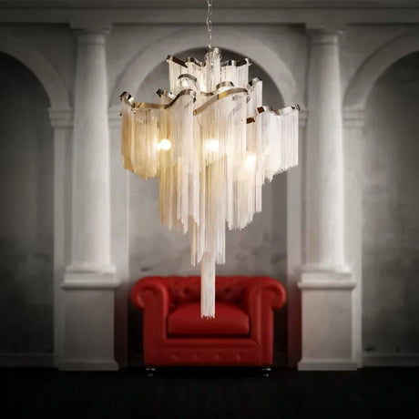 The silver version hanging between stone columns above a deep red button sofa